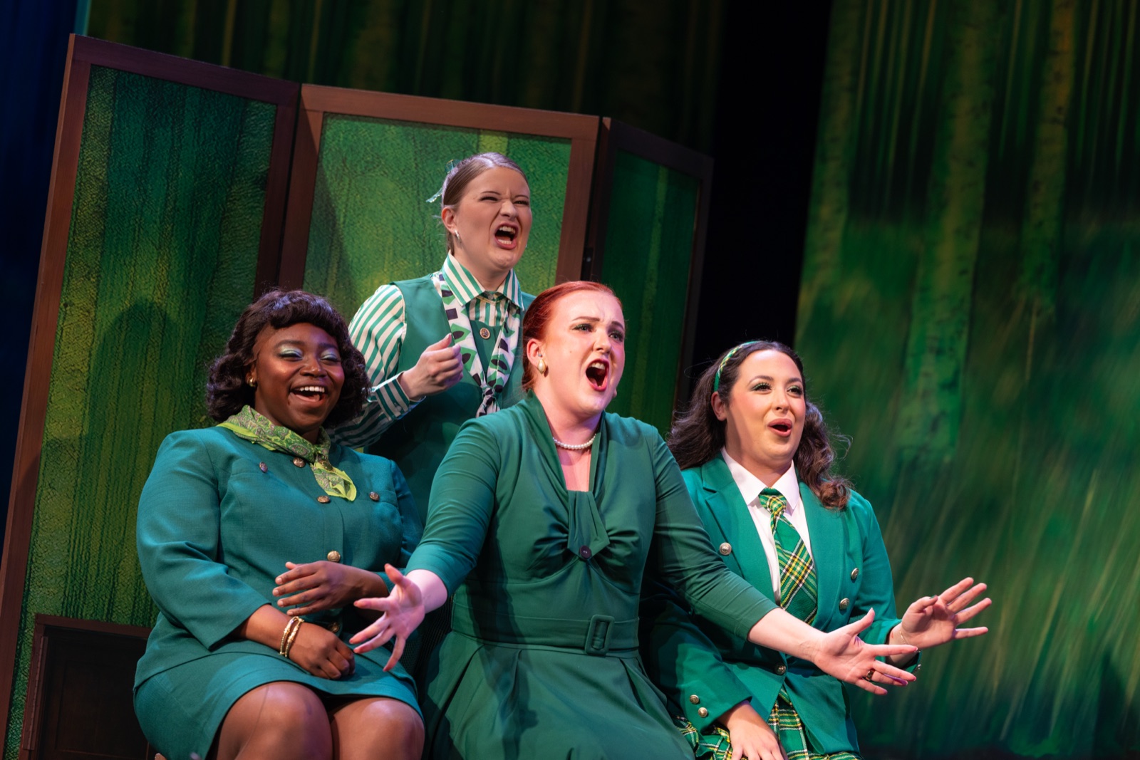Veronica Richer in a green costume on stage