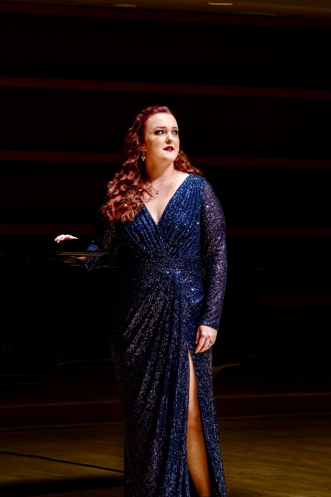 Veronica Richer in a sequined blue gown in recital